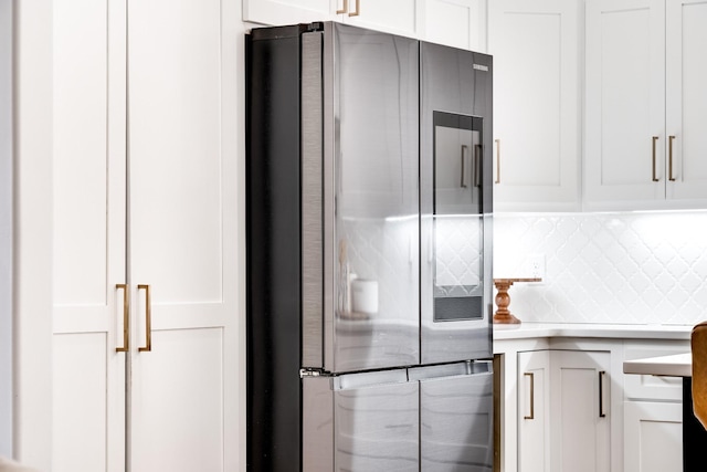 kitchen featuring backsplash, white cabinets, smart refrigerator, and light countertops