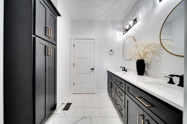 full bathroom with visible vents, marble finish floor, baseboards, and a sink