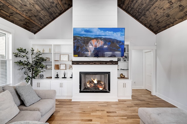 living area featuring high vaulted ceiling, a fireplace, wood ceiling, and light wood-type flooring