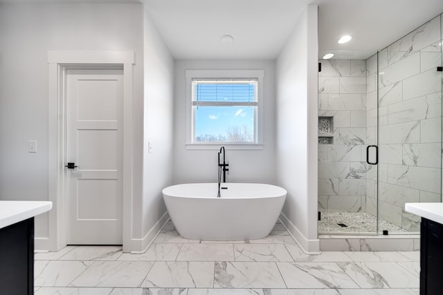 full bath featuring marble finish floor, a stall shower, baseboards, a freestanding bath, and vanity