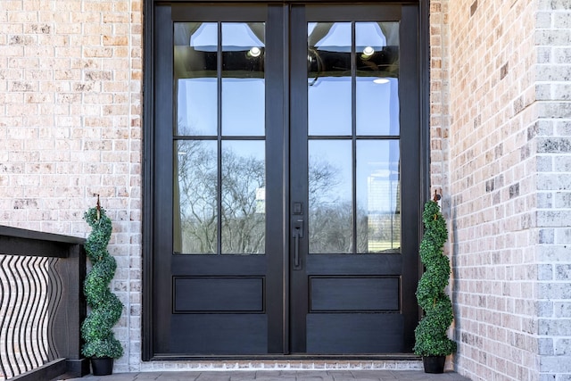 entrance to property with french doors and brick siding