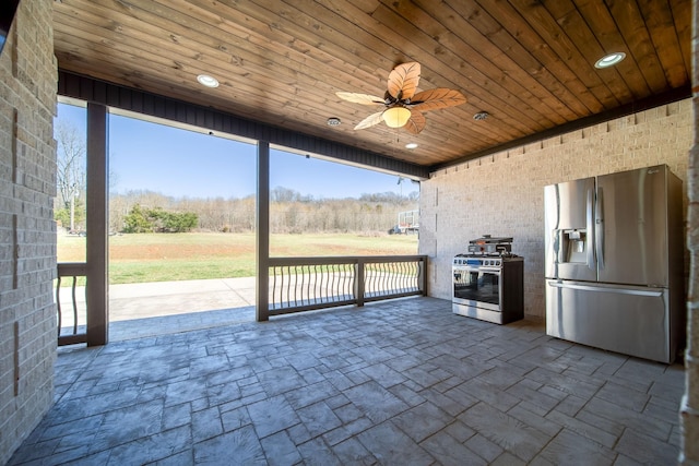 view of patio featuring ceiling fan