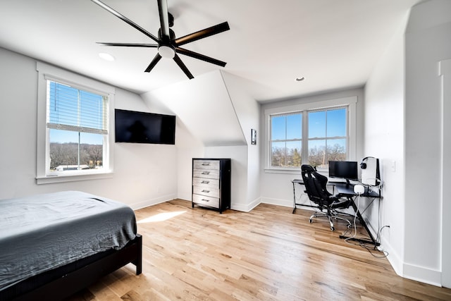 bedroom featuring wood finished floors, baseboards, lofted ceiling, recessed lighting, and ceiling fan