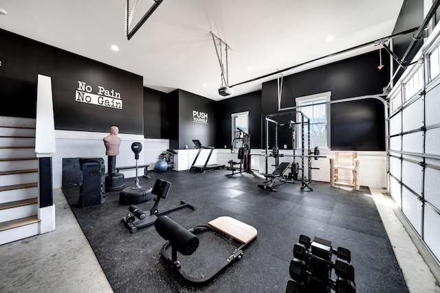 gym with recessed lighting and a garage