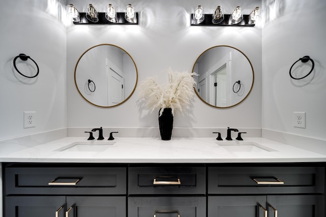 full bathroom with a sink and double vanity