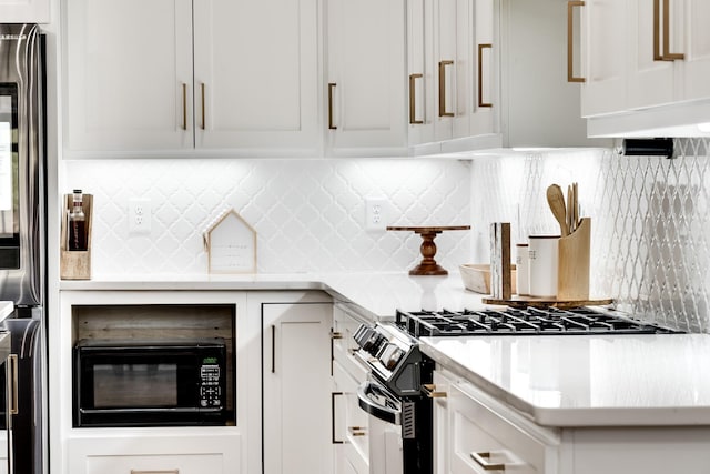 kitchen with white cabinetry, light countertops, tasteful backsplash, and stainless steel appliances