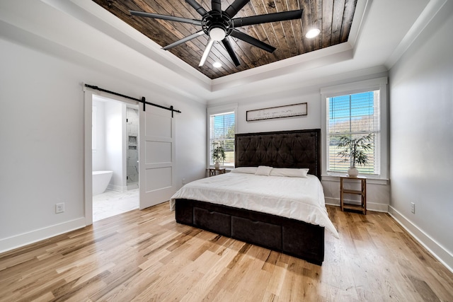 bedroom featuring a tray ceiling, a barn door, wood ceiling, and wood finished floors