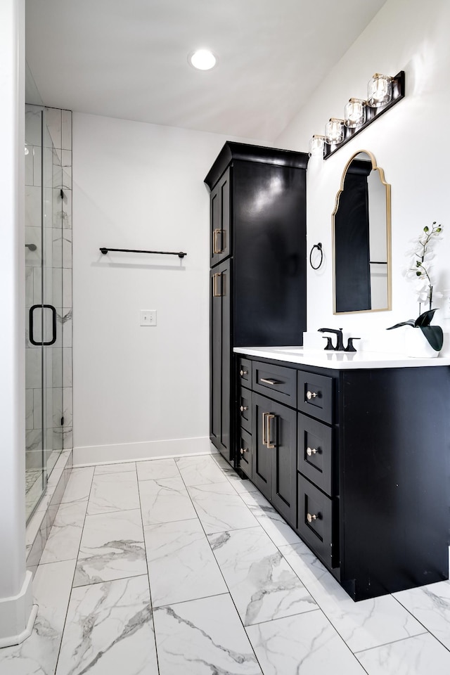 bathroom featuring vanity, baseboards, recessed lighting, a shower stall, and marble finish floor