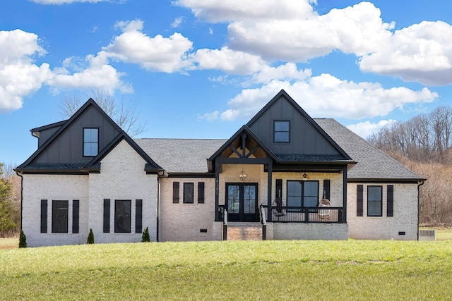 exterior space featuring crawl space, brick siding, board and batten siding, and a yard