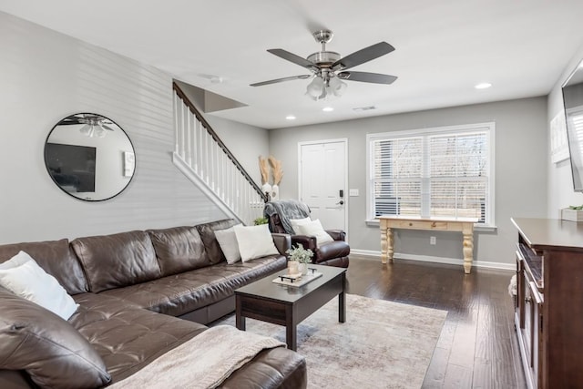 living area featuring visible vents, baseboards, stairway, recessed lighting, and dark wood-style floors