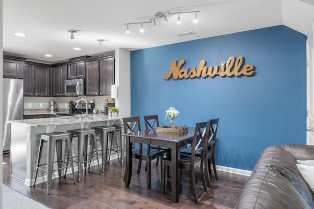 dining area with dark wood finished floors, recessed lighting, baseboards, and visible vents