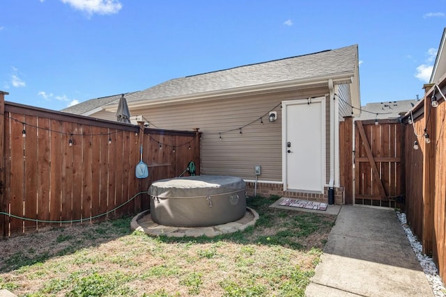 view of outbuilding featuring a gate and fence