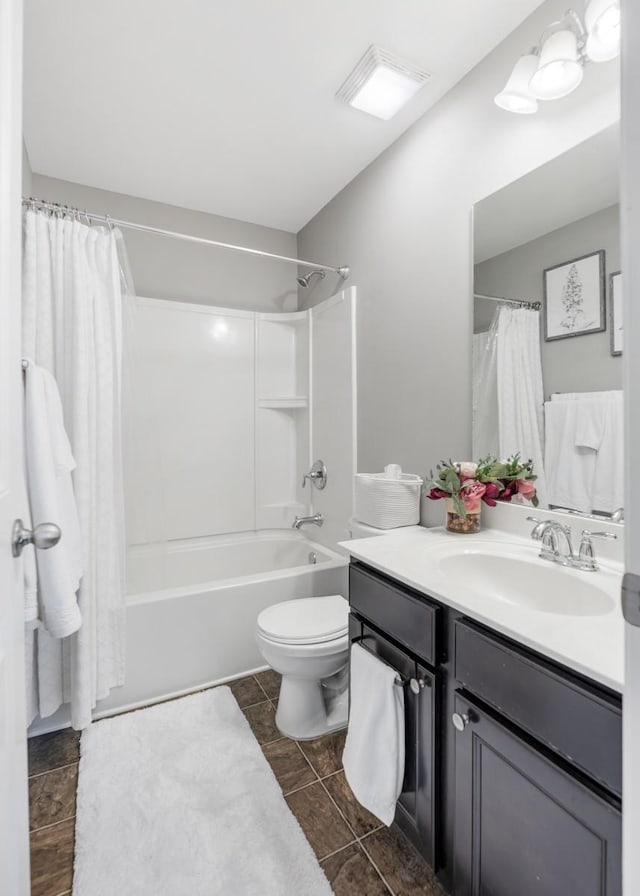 full bath with toilet, vanity, and shower / bathtub combination with curtain