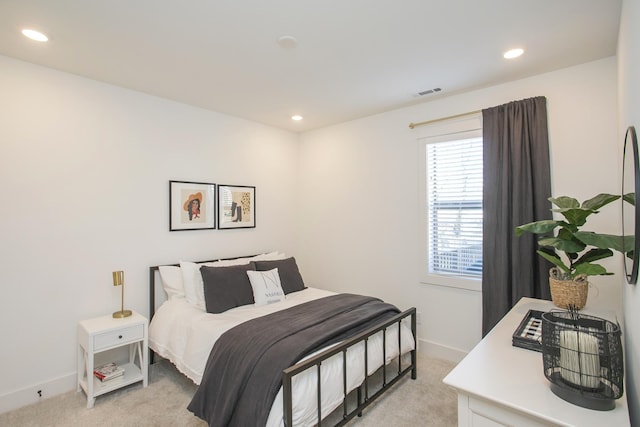 bedroom featuring recessed lighting, light colored carpet, and visible vents