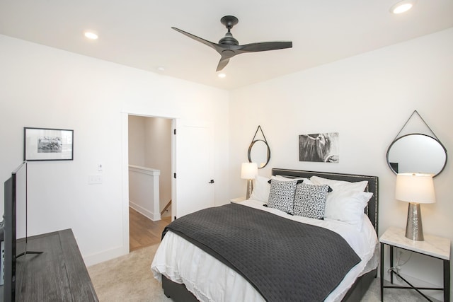 bedroom with ceiling fan, recessed lighting, baseboards, and light carpet