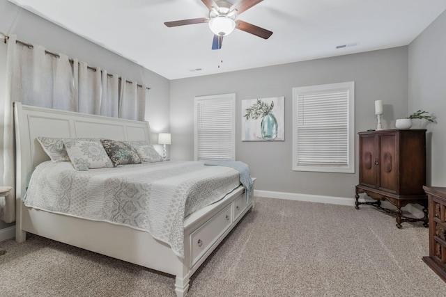 bedroom featuring carpet flooring, baseboards, visible vents, and ceiling fan