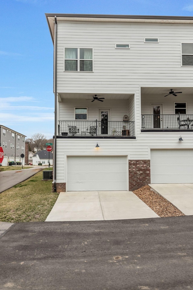 townhome / multi-family property featuring central AC, an attached garage, concrete driveway, and a ceiling fan