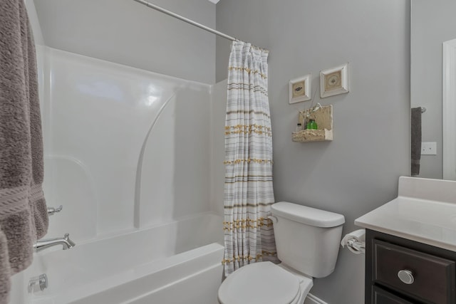 full bathroom with shower / tub combo with curtain, vanity, and toilet