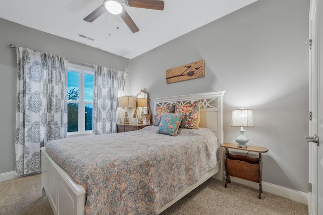 bedroom with visible vents, baseboards, and carpet