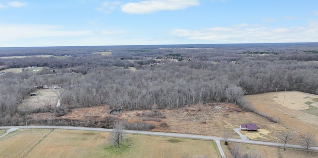 birds eye view of property with a forest view