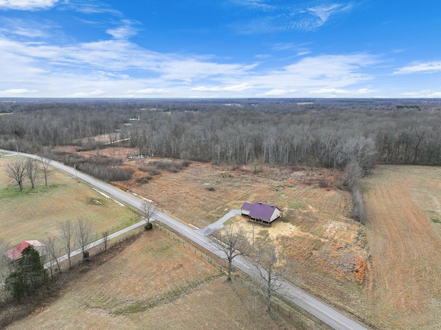 birds eye view of property with a rural view