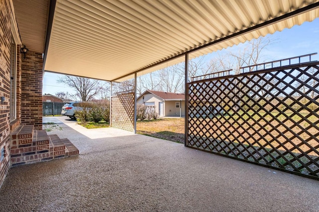 view of patio featuring fence