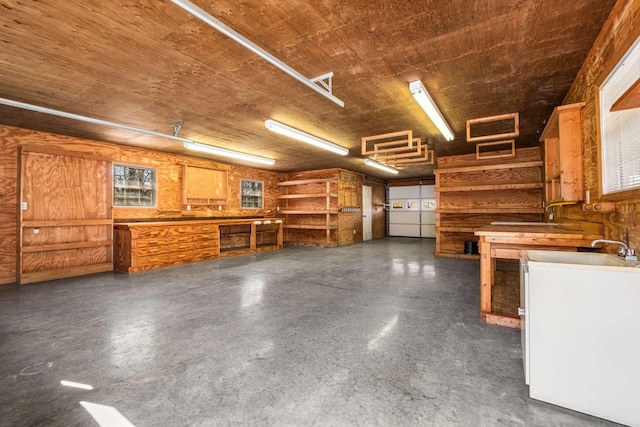 garage with a workshop area and a sink