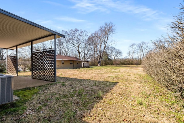 view of yard with central air condition unit