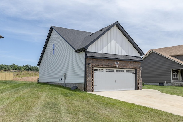 view of side of home with brick siding, a lawn, driveway, and an attached garage