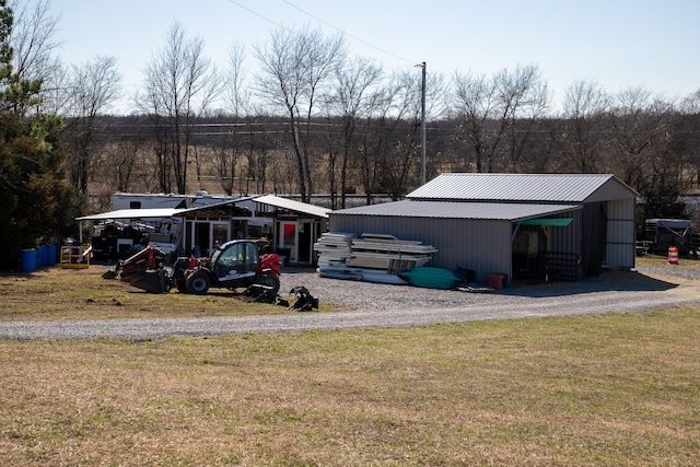 view of pole building with a yard