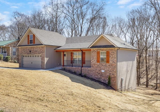 single story home with brick siding, a porch, driveway, and a garage