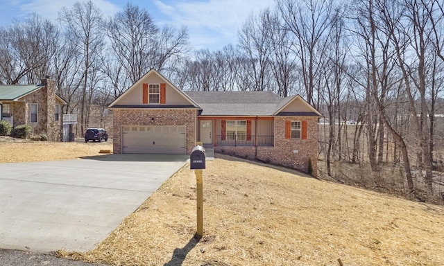 view of front of property featuring brick siding, a front lawn, concrete driveway, and a garage