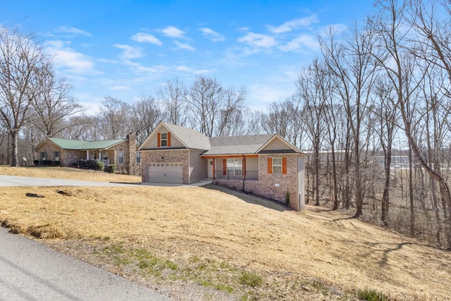 ranch-style home with a garage and brick siding