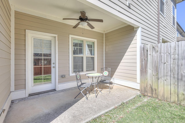 view of patio with fence and ceiling fan