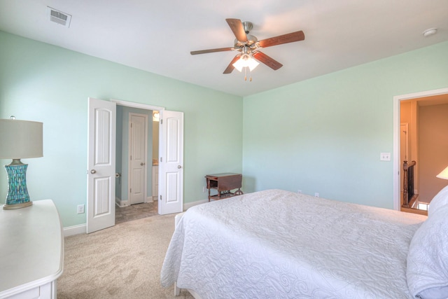 bedroom featuring visible vents, carpet floors, baseboards, and a ceiling fan