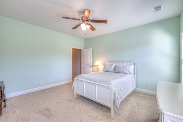 bedroom with visible vents, baseboards, and carpet