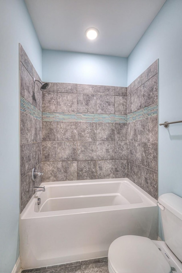 full bathroom featuring bathtub / shower combination and toilet