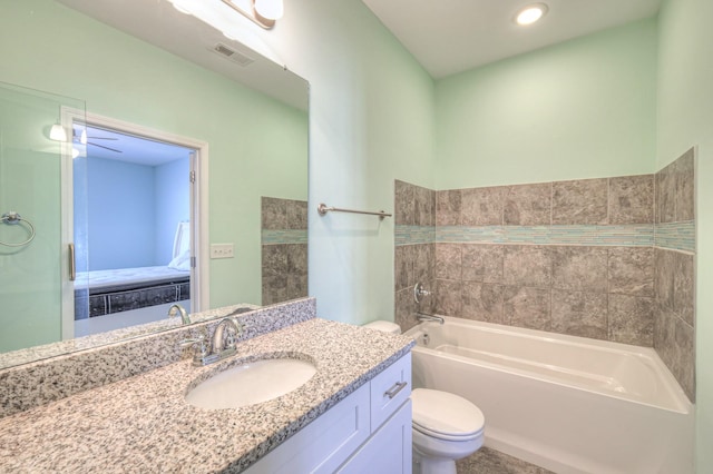 full bathroom with a tub, visible vents, toilet, and vanity