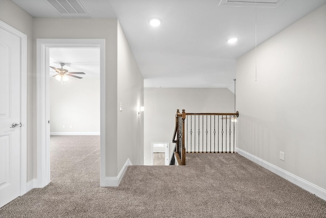 hall featuring carpet, visible vents, attic access, recessed lighting, and an upstairs landing