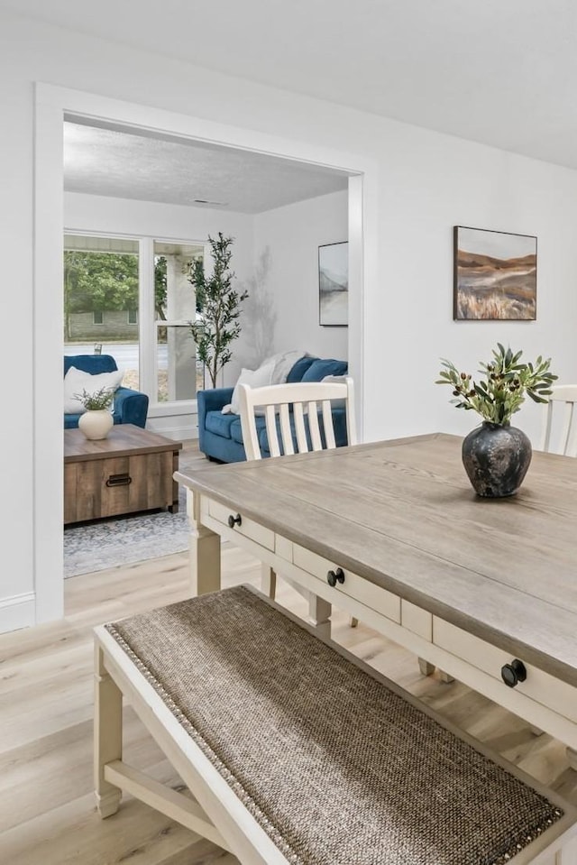 dining space with light wood-style floors