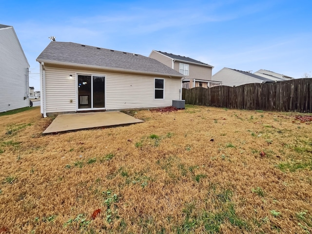 back of house with a yard, a patio, cooling unit, and fence