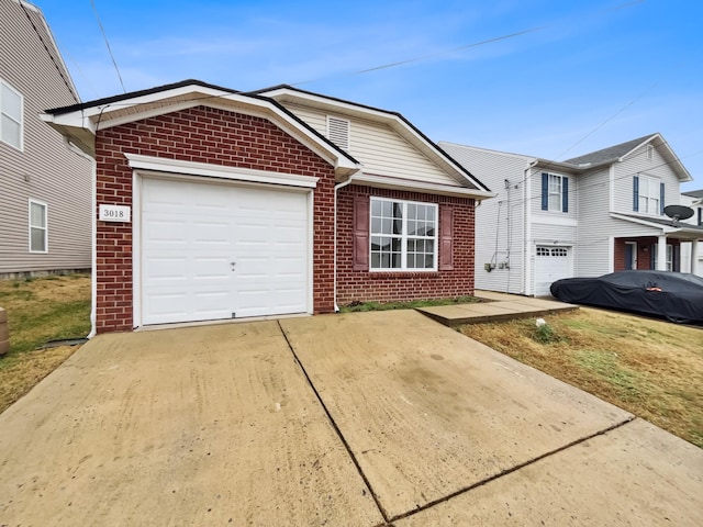 view of front of property with concrete driveway, a garage, and brick siding