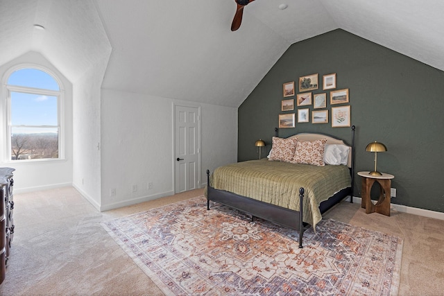bedroom with baseboards, lofted ceiling, carpet floors, and ceiling fan