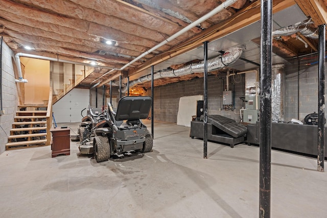 unfinished basement with tankless water heater and stairway