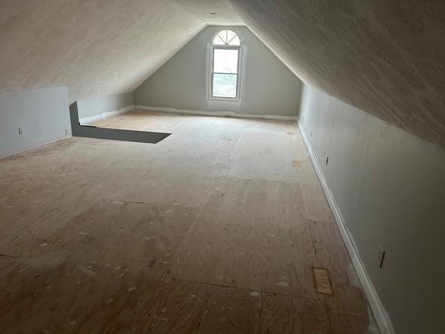 bonus room with vaulted ceiling