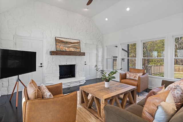 living area with ceiling fan, vaulted ceiling, recessed lighting, a fireplace, and wood finished floors