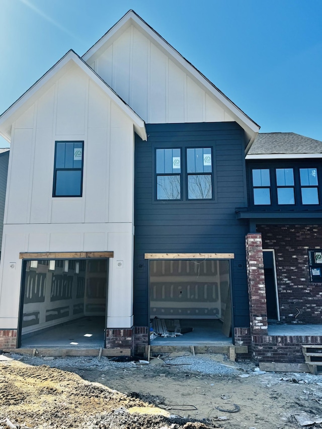 view of front of property with board and batten siding and a garage