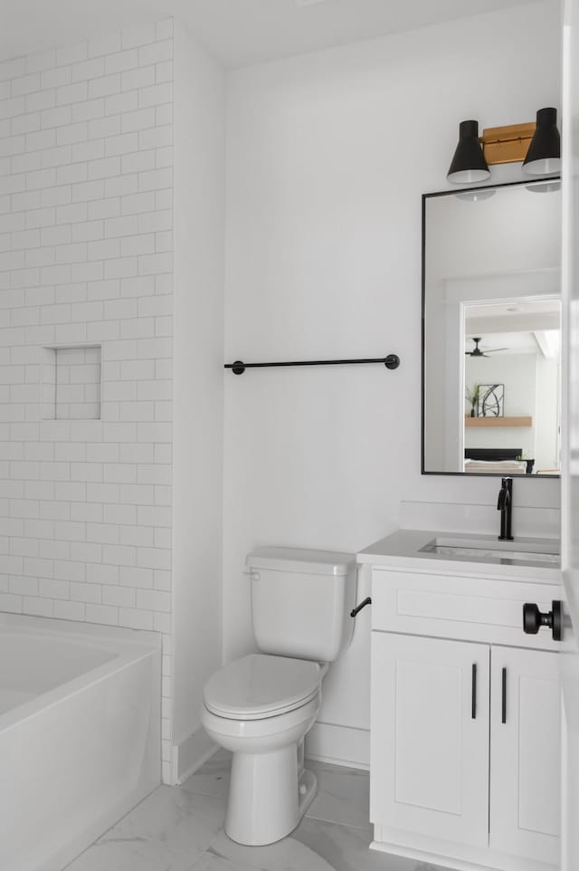 full bathroom featuring vanity, baseboards, shower / washtub combination, toilet, and marble finish floor