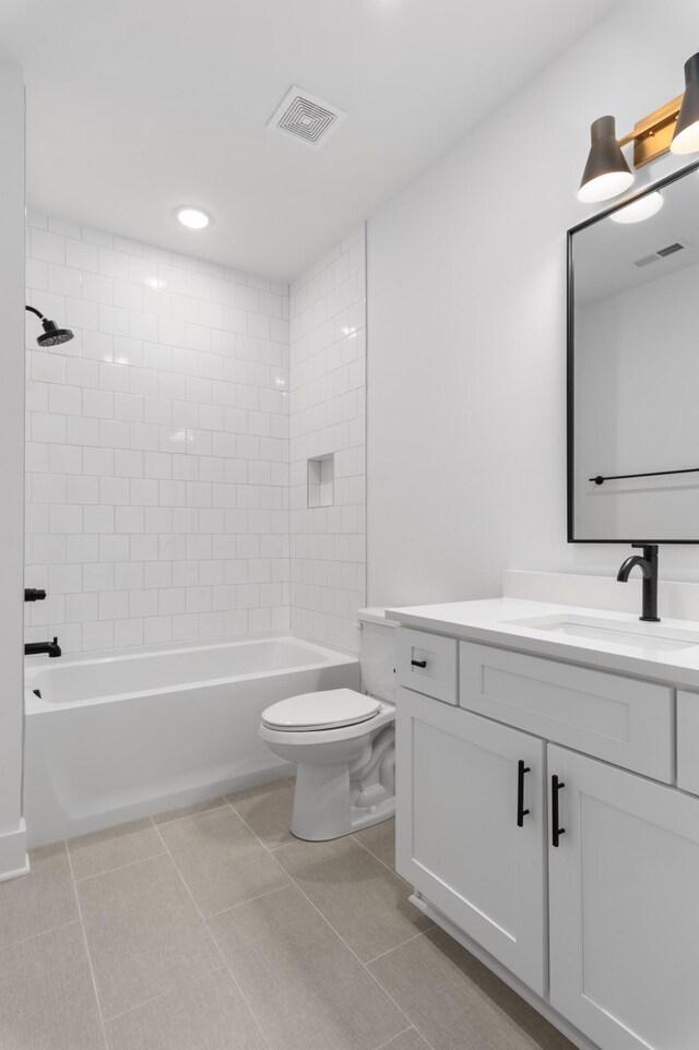 full bathroom featuring tile patterned flooring, visible vents, toilet, and vanity