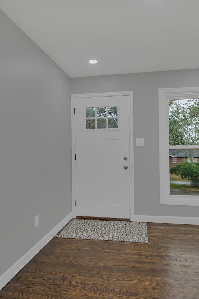 foyer with recessed lighting, baseboards, and wood finished floors